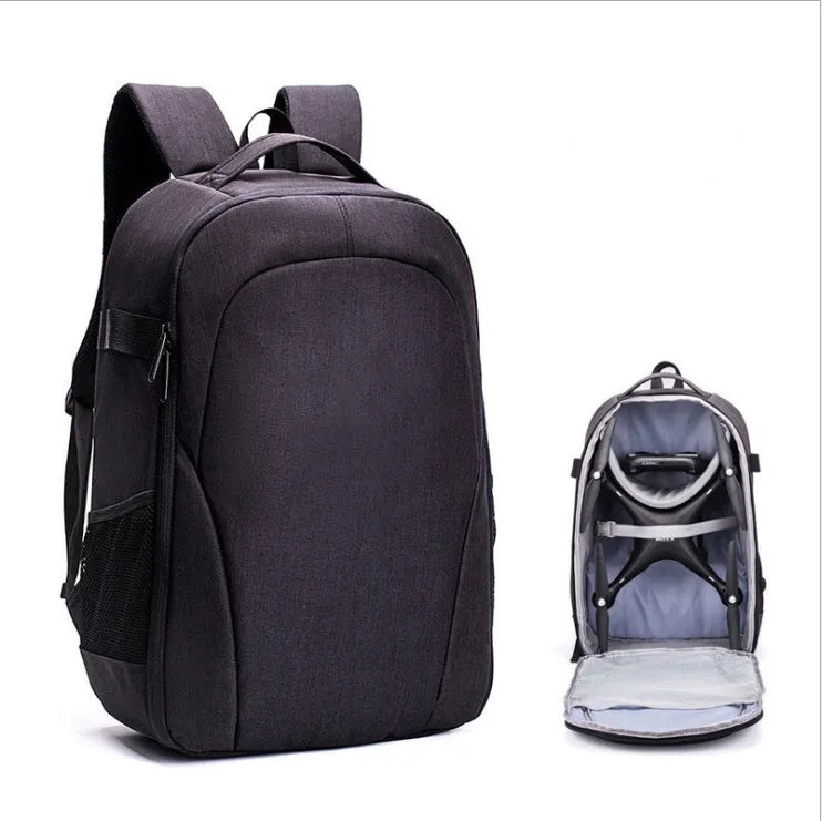 Black Oxford cloth drone backpack showing multiple internal compartments for camera and laptop storage