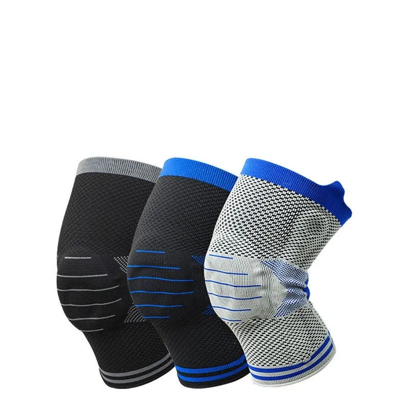 Close-up of a grey and blue cotton knee pad showing the silicone massage spring bar and shock absorber design.