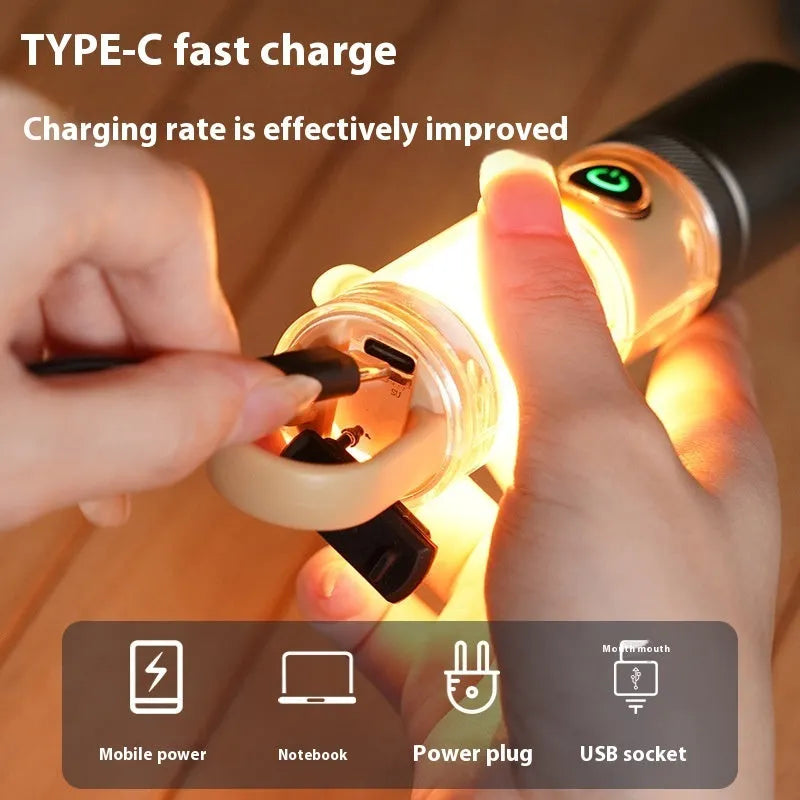 Orange and beige coloured LED torch with keychain loop, showing dual-light lens and USB port.
