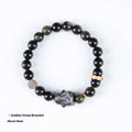 Handmade Chinese style bracelet with lying rabbit charm, grey agate bead, and brass on a black background.