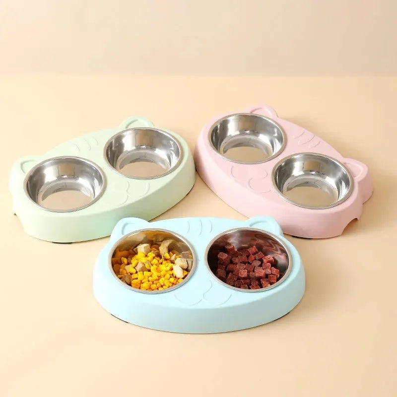 Blue macaron-shaped plastic pet feeder tray with two bowls for food and water.