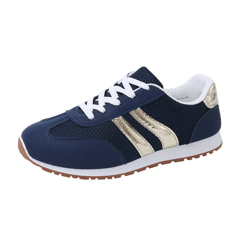 Blue women's casual tennis shoes with cross shoulder straps and white rubber sole.