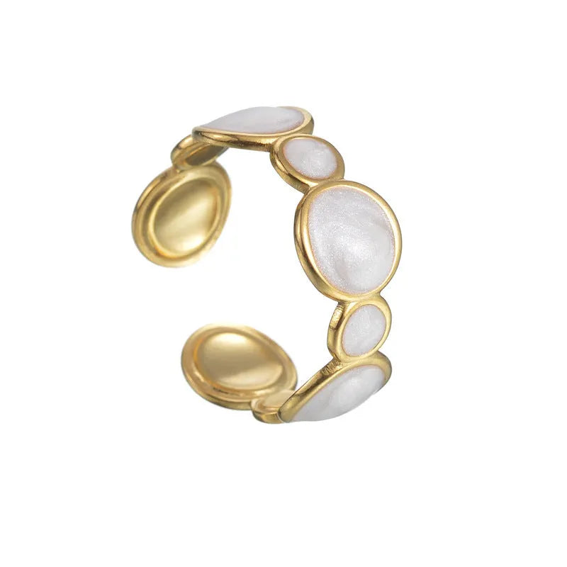 Silver geometric adjustable stainless steel ring for women on a plain background