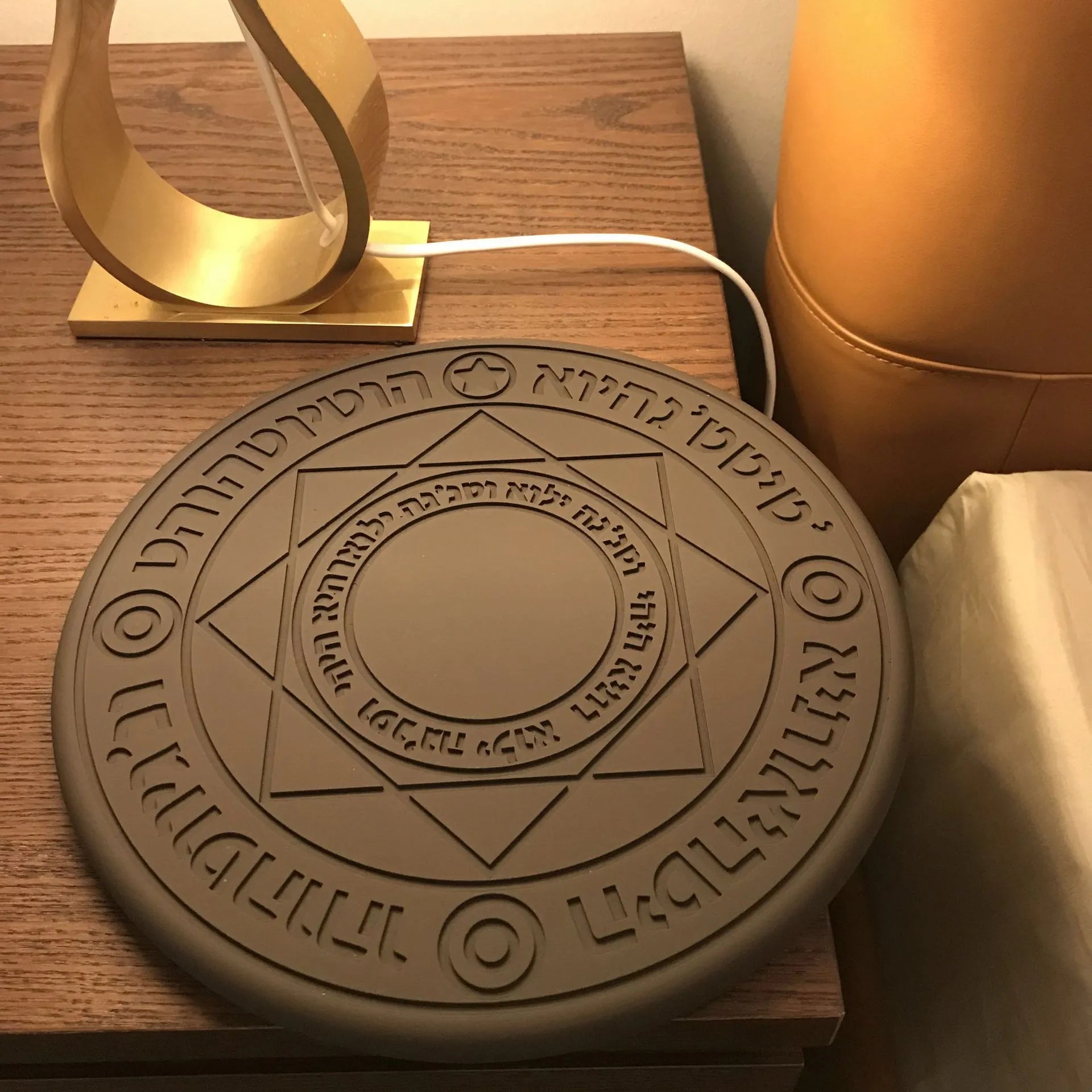 Square wireless phone charger with magic array pattern design showing ultra-thin 1.5cm profile