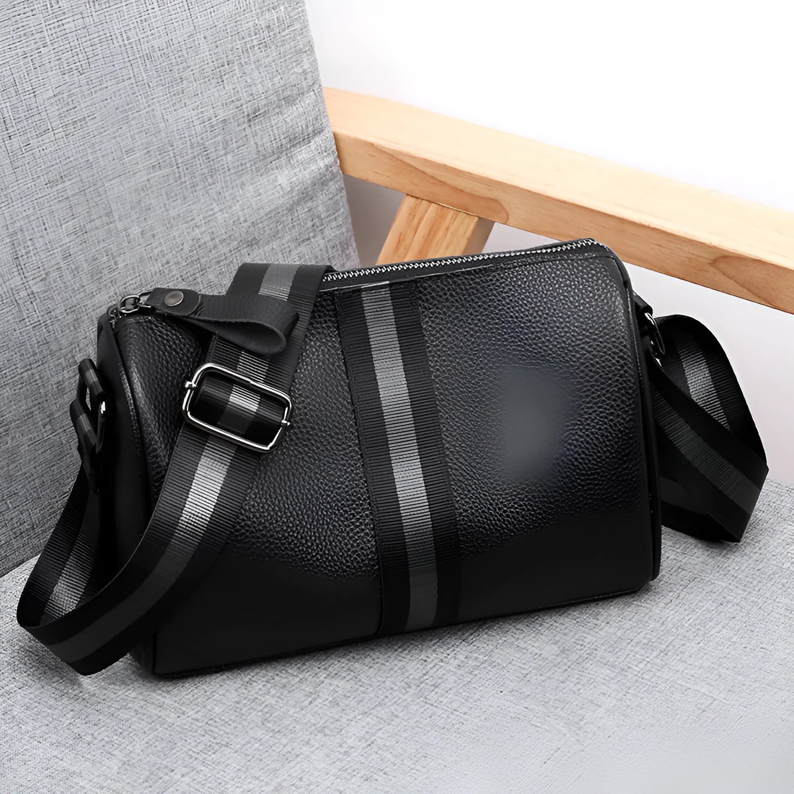 Black genuine leather one-shoulder crossbody bag showing front view