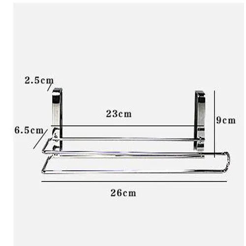Silver stainless steel paper towel rack hanging on a kitchen cabinet door.