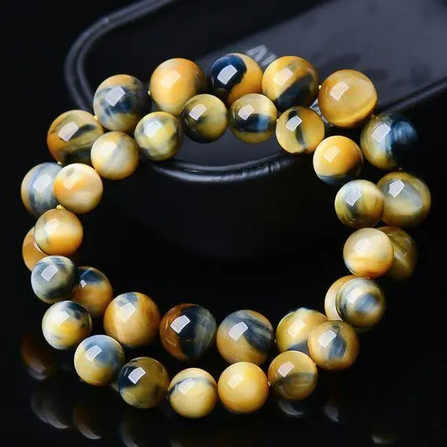 Handmade fantasy tiger eye agate unisex bracelet with round beads in 8mm, 10mm or 12mm sizes.