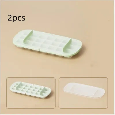 Blue high capacity ice cube tray with integrated storage for an ice shovel, showing the grid layout.