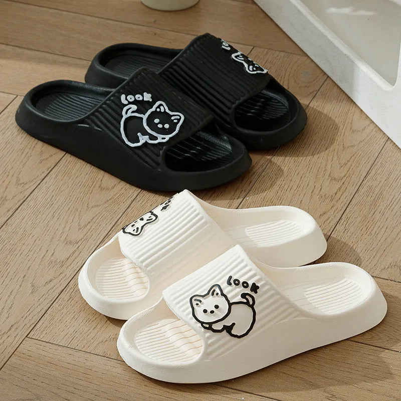 Women's cat platform slippers in pink with thick EVA sole, shown on a wooden floor.