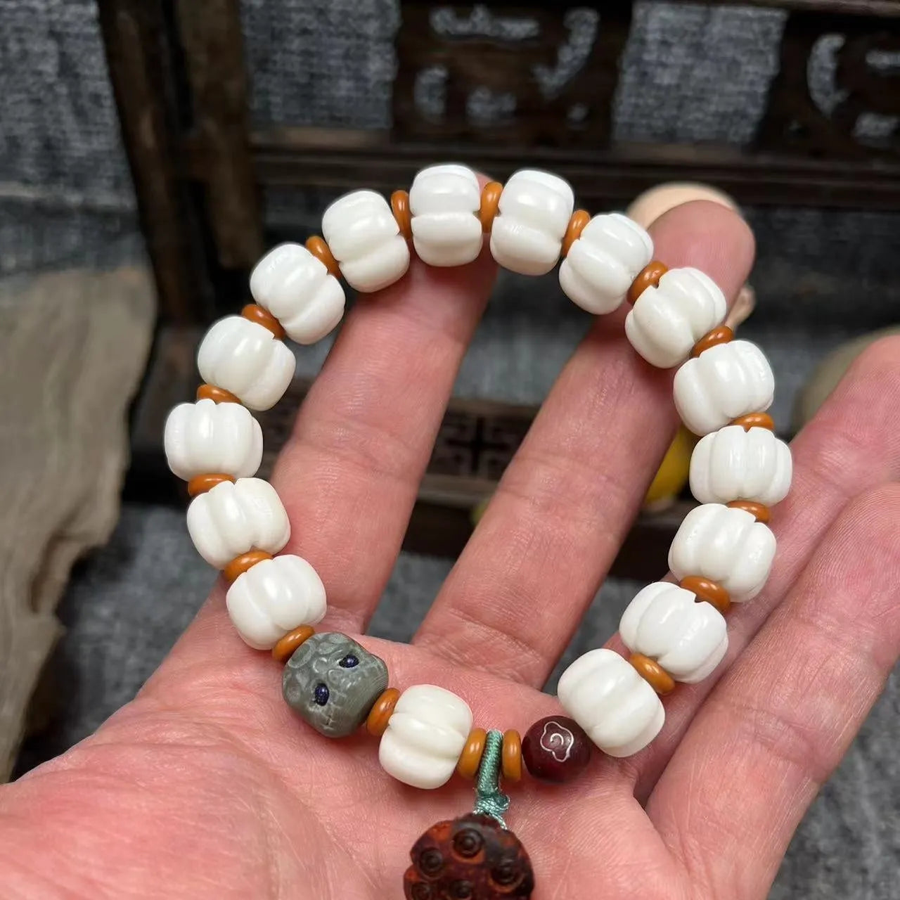 Carved pumpkin lotus Bodhi root bracelet with white jade beads and multiple dimensions