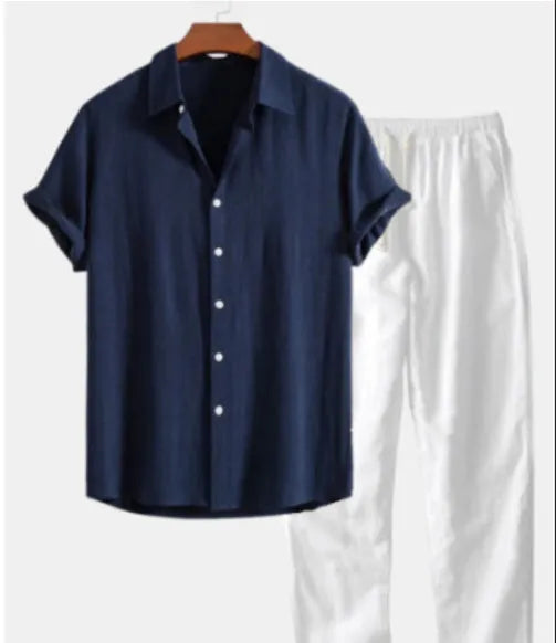 Men's green and blue flower print polyester slim fit casual shirt suit set on a hanger.