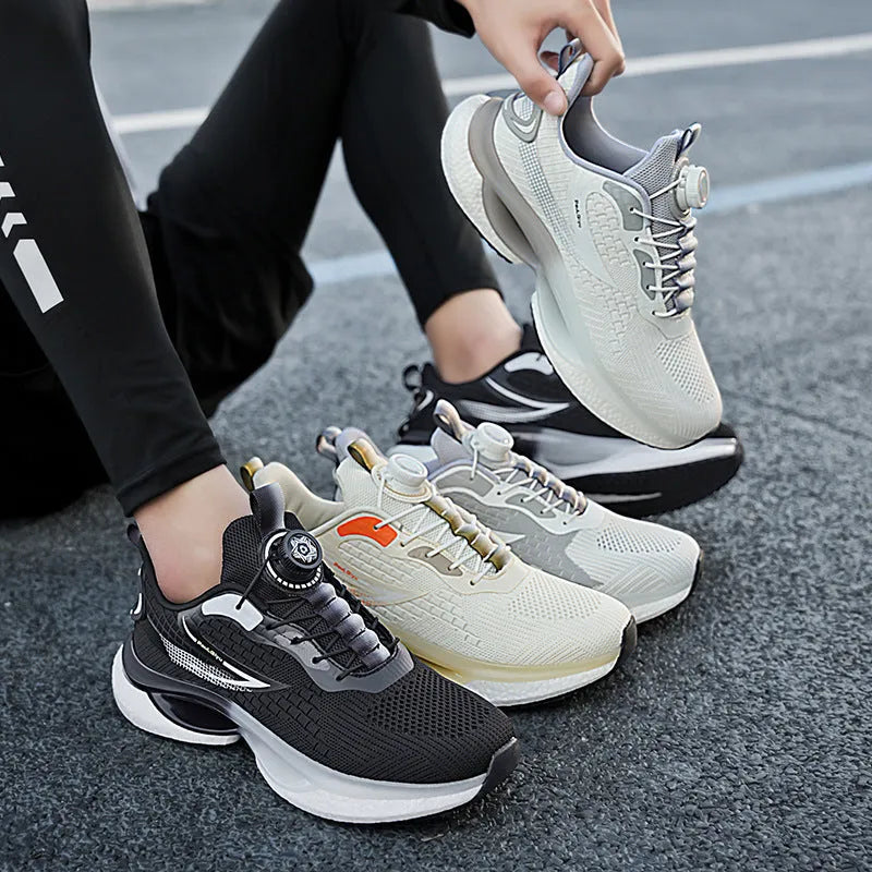 Men's white low-top running shoes with a rotating button buckle and round toe on a gray background.