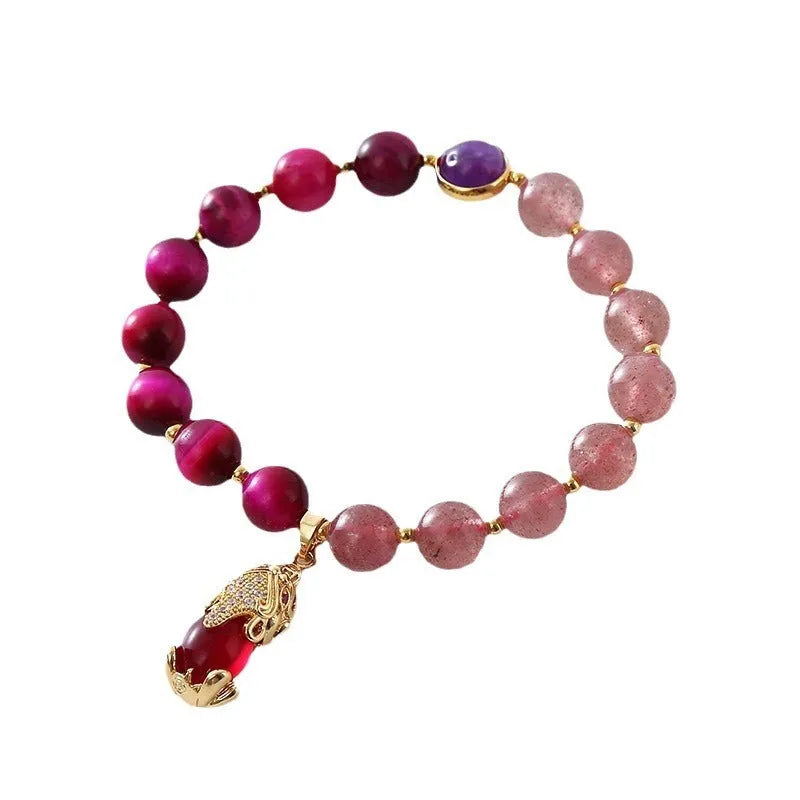 Women's simple strawberry crystal elastic bracelet showing natural stones on stretchable 18cm band