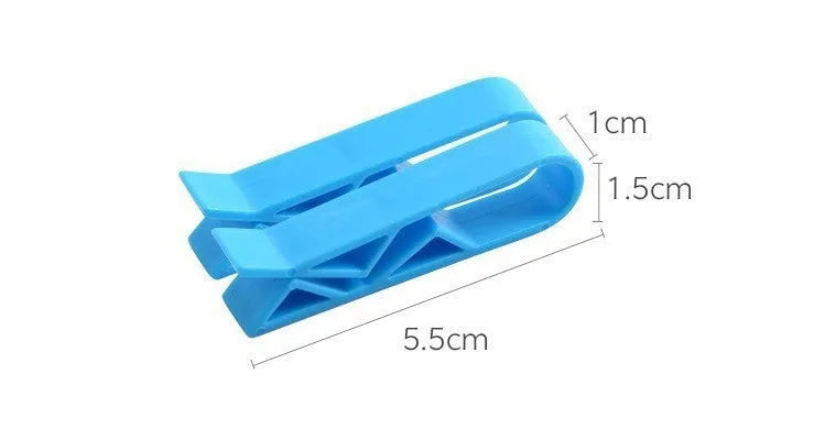 A white polypropylene plastic clip for holding bin bags onto the side of a rubbish bin.