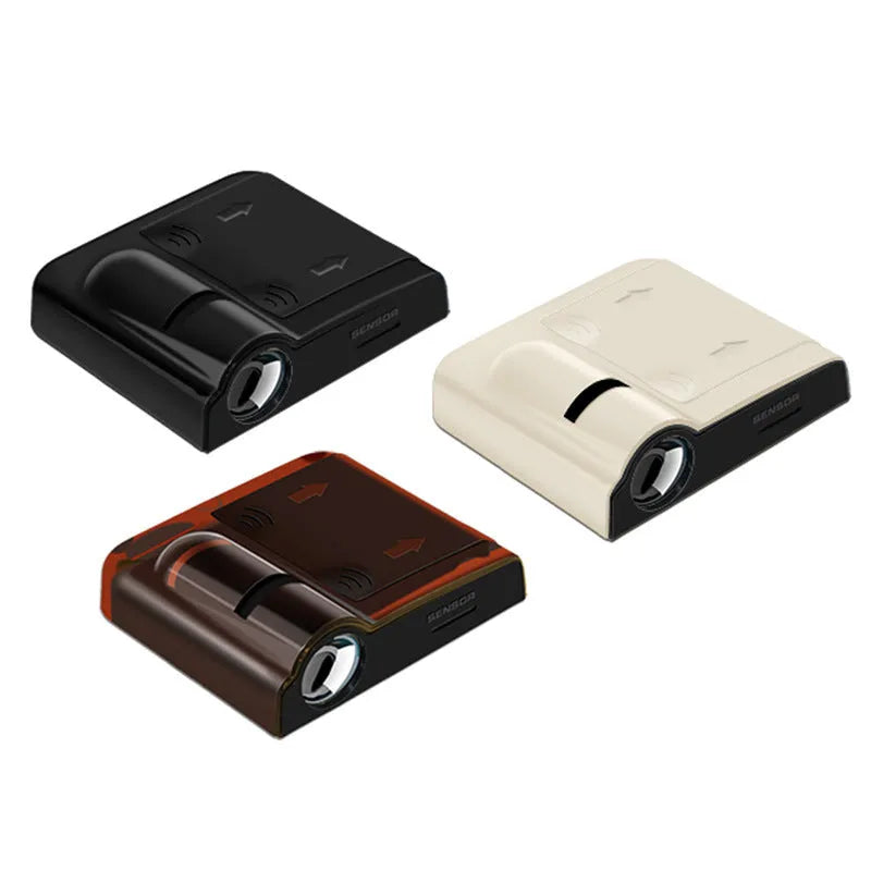 Compact black car interior projection lamp with universal fit, shown next to three AA batteries for scale.