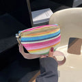 Blue bohemian style straw beach bag with single shoulder strap showing sandwich pocket design