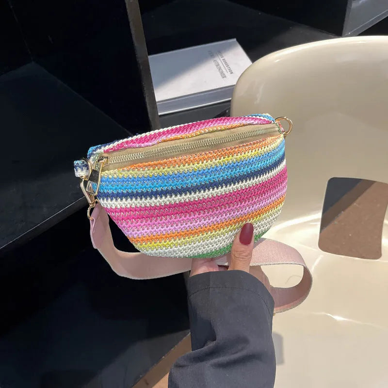 Blue bohemian style straw beach bag with single shoulder strap showing sandwich pocket design