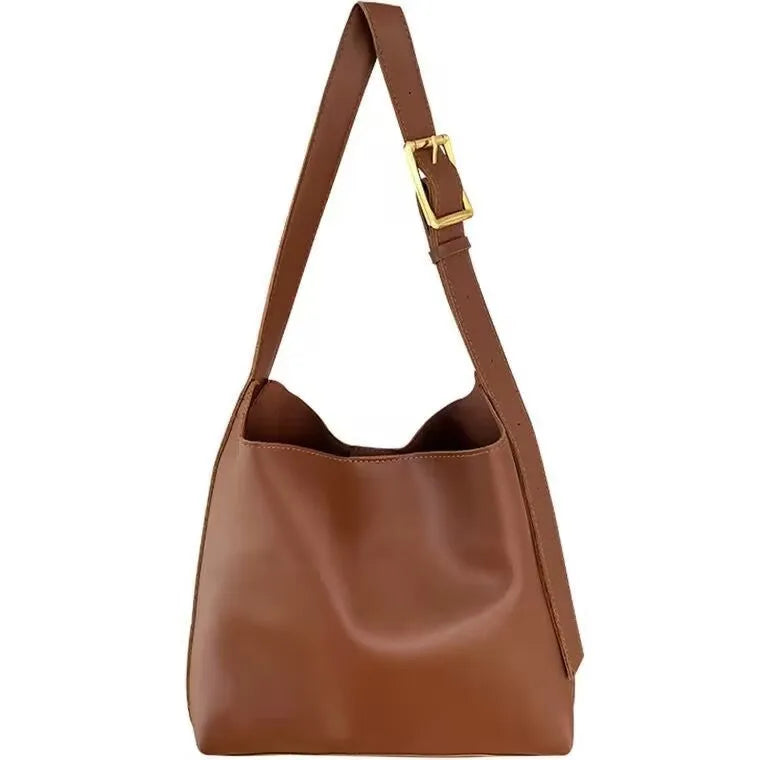 Two women's fashion shoulder bags in black and brown PU leather with swing thread details