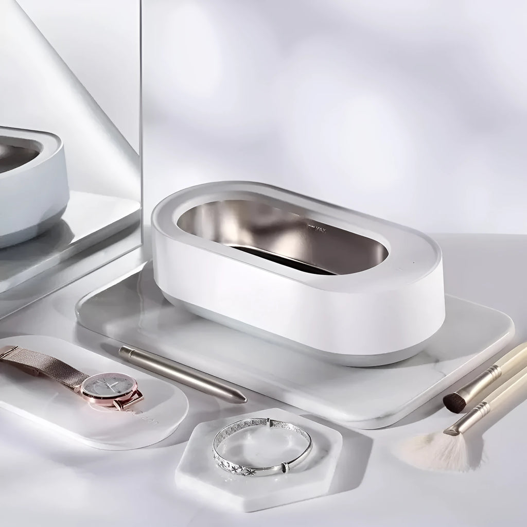 White portable ultrasonic cleaning machine with stainless steel tank for jewellery and glasses.