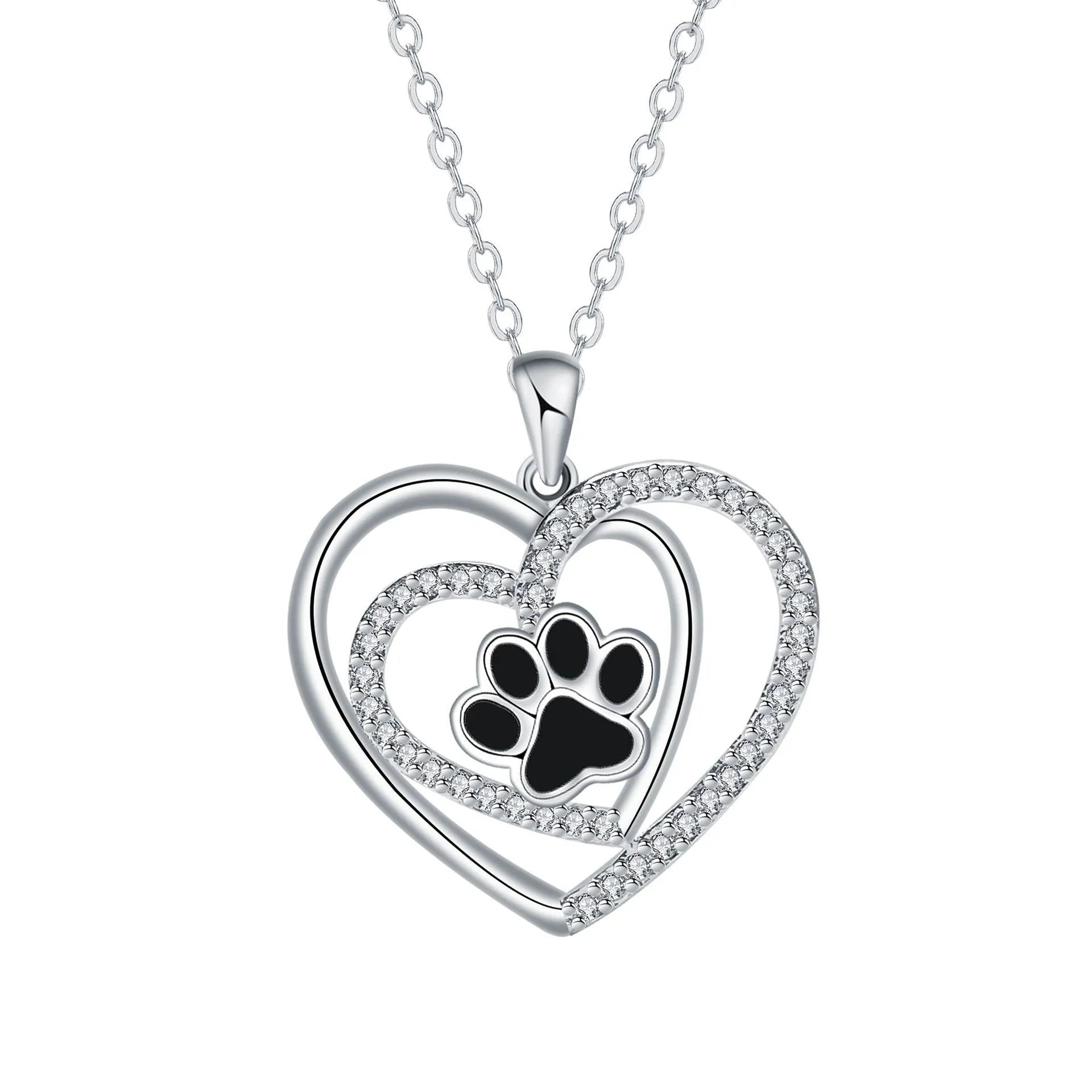 Close-up of a heart-shaped copper necklace pendant featuring a detailed dog's paw print design on a cross chain.