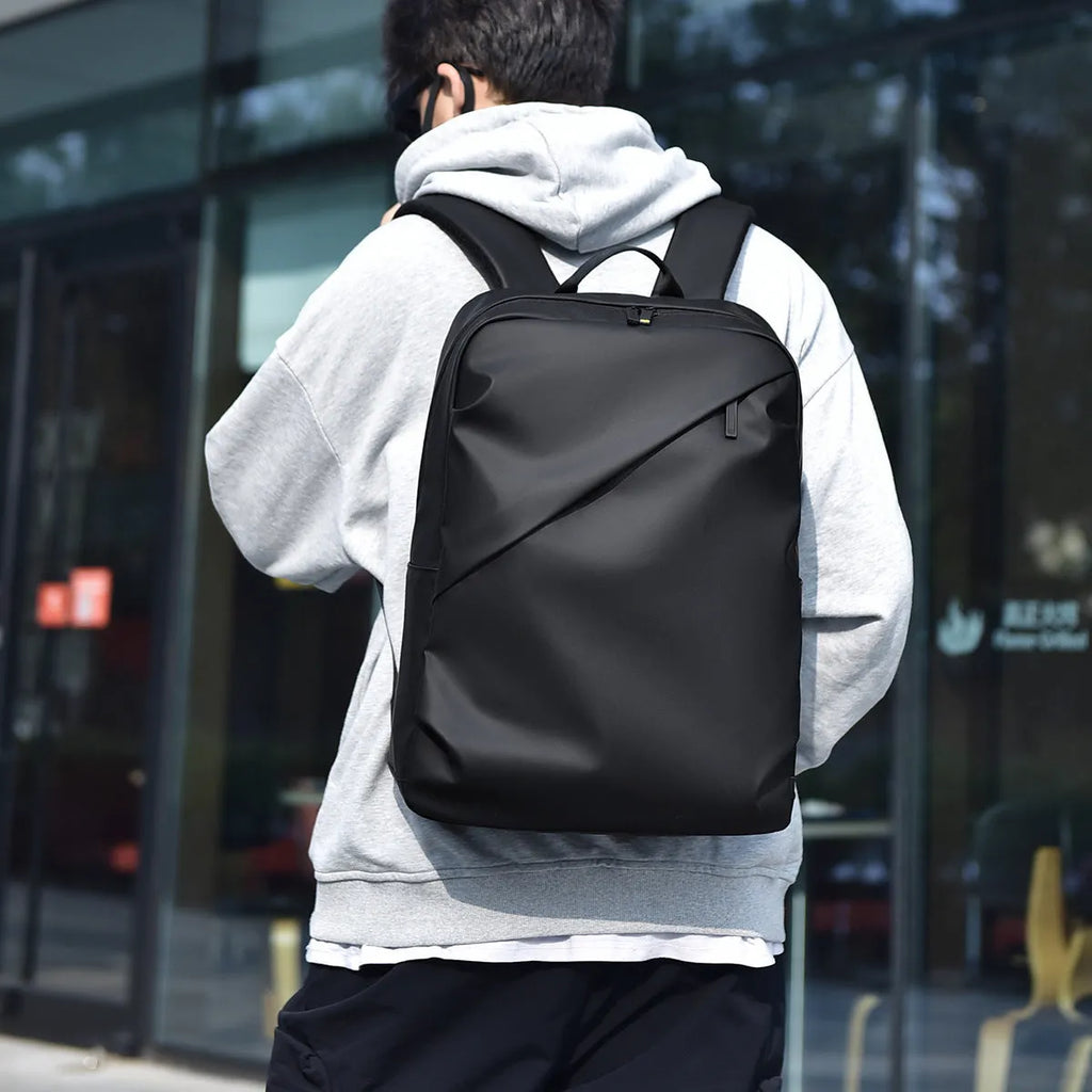 Black waterproof PU leather backpack for men with large capacity and computer compartment
