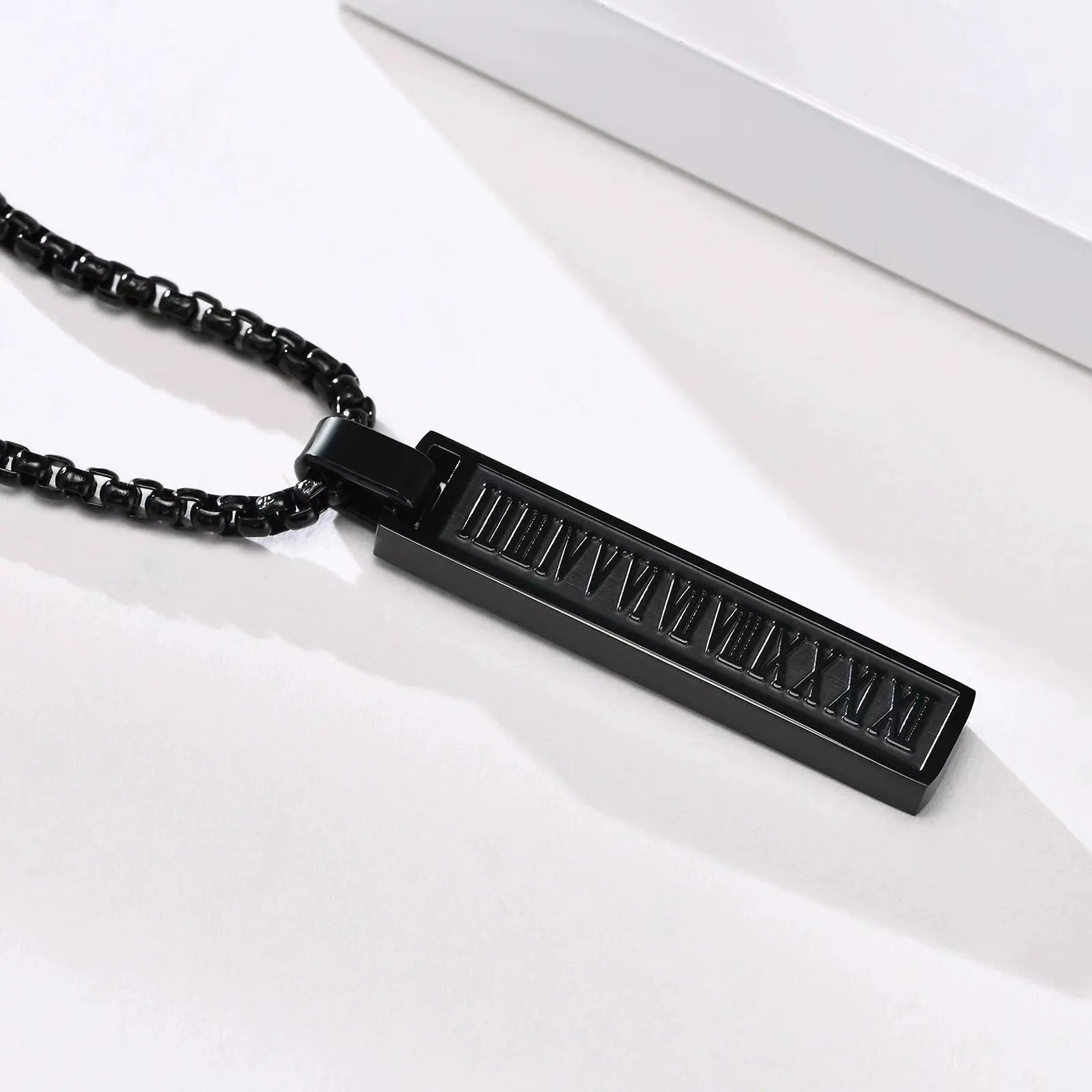 Stainless steel roman numeral pendant necklace available in black, gold, and steel colour options