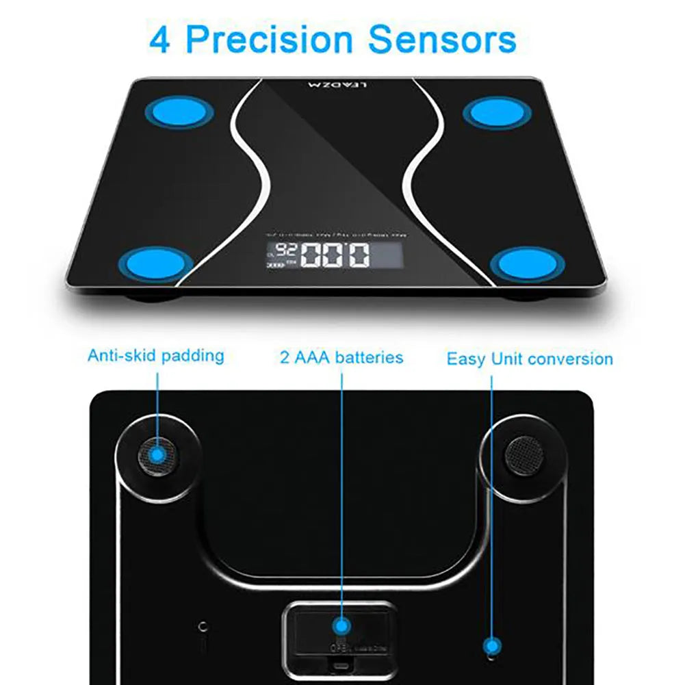 Black electronic digital bathroom scale with a digital display, shown on a bathroom floor.