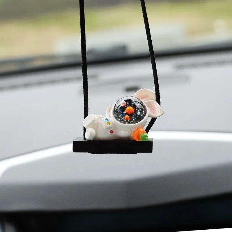 Resin astronaut car pendant showing five cartoon astronaut designs for vehicle decoration