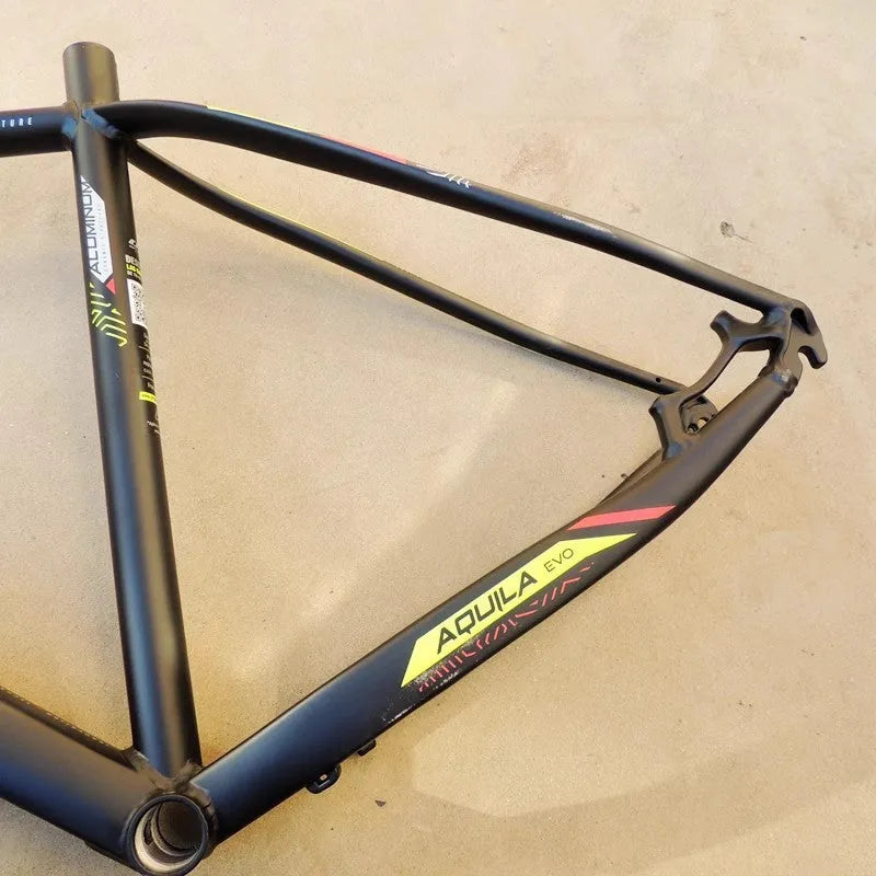 Black Green 29-inch aluminium mountain bike frame with disc brake mounts and inner line routing.