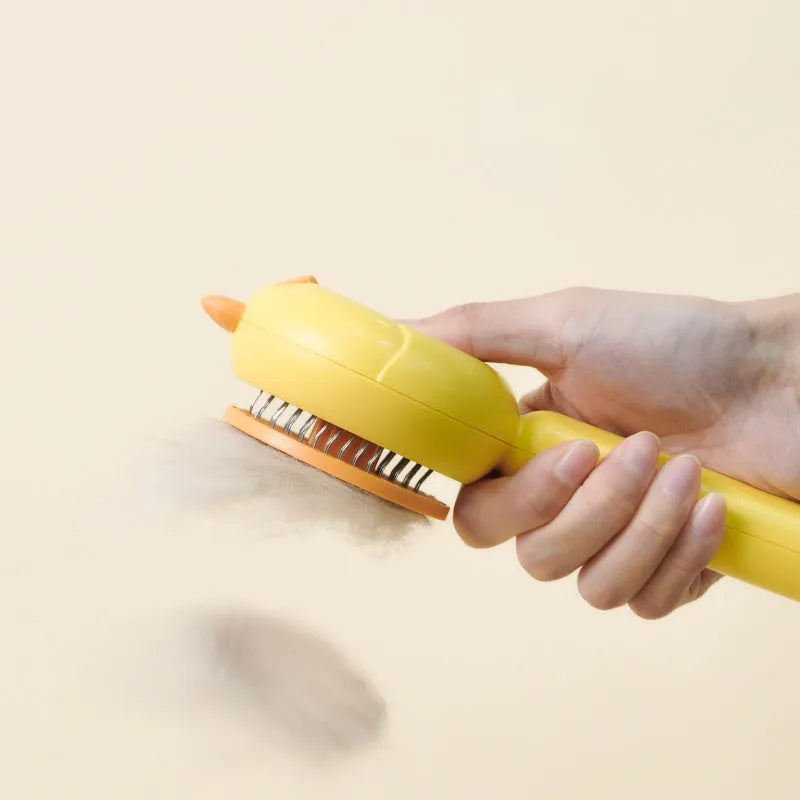 Purple and white self-cleaning pet grooming brush with bent stainless steel bristles on a wooden table.