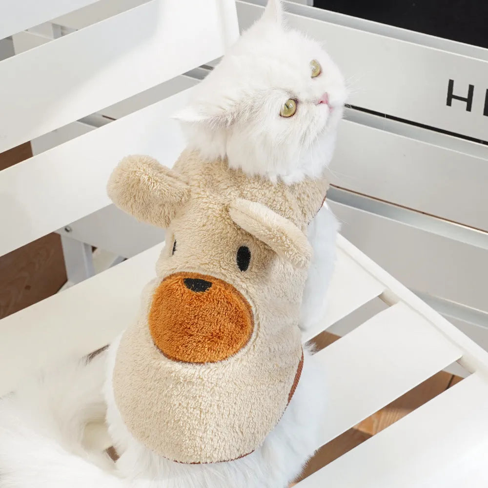 Fleece-lined warm polyester dog coat in cream with bear ears, lying flat showing size tag