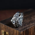 Silver open ring with a personalised diamond jibeast animal zodiac pattern on a hand.