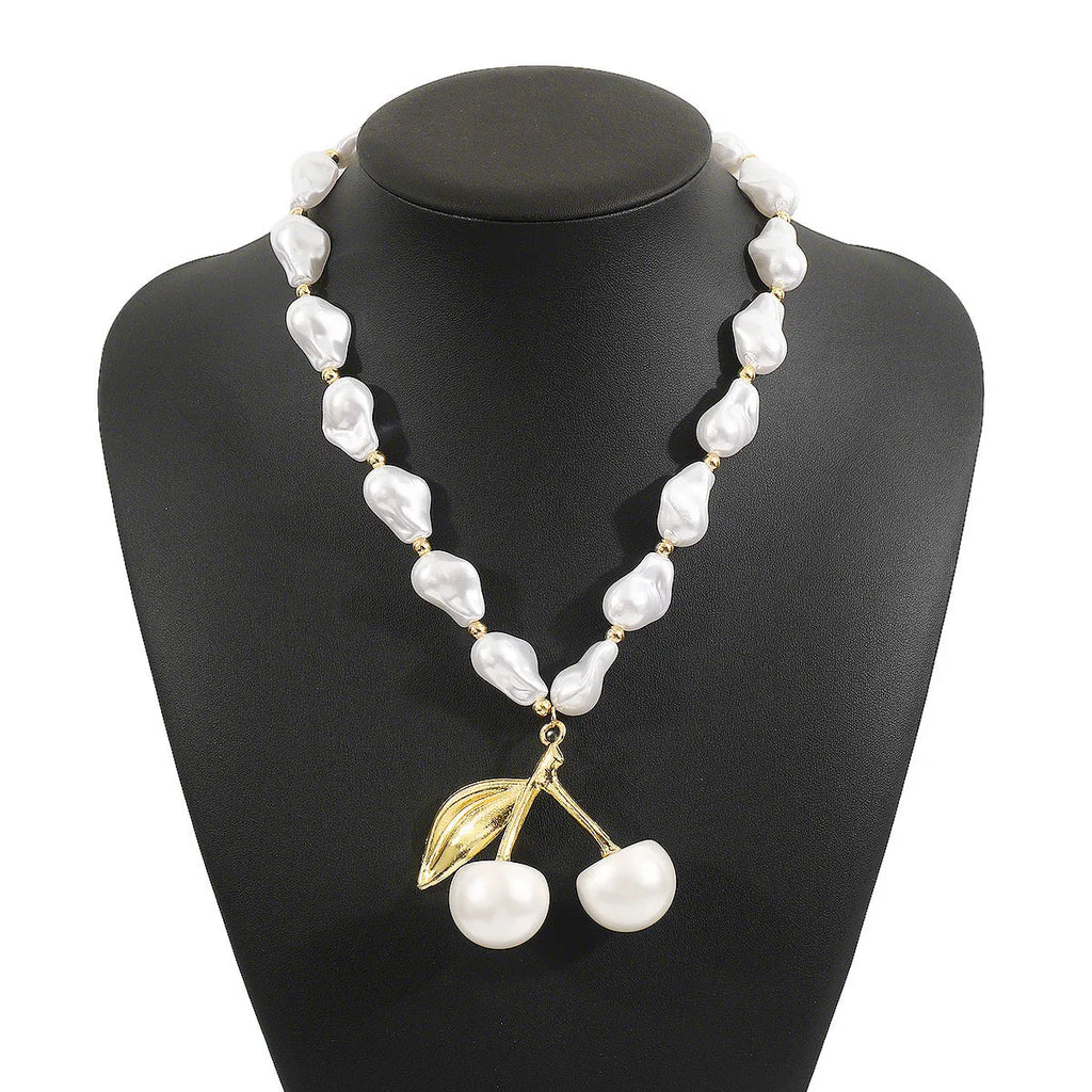 Women's adjustable cherry necklace with geometric fruit pendant on imitation pearl chain in gold or white K colour