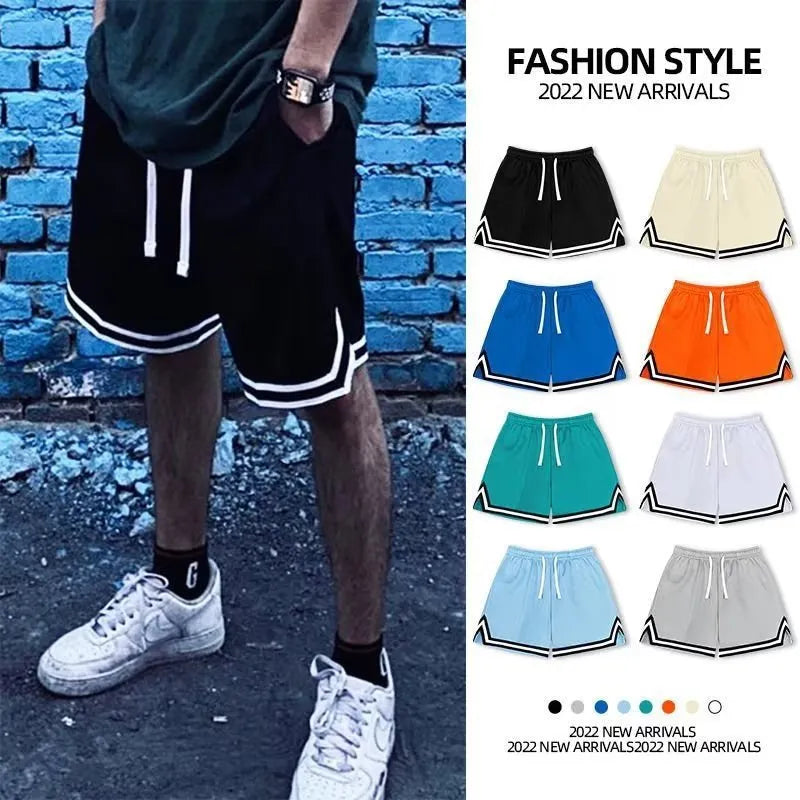 Men's loose-fit polyester sports shorts in multiple colour options with elastic waistband