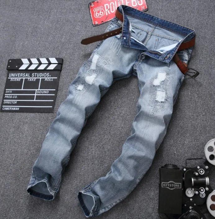 Mens light blue ripped slim fit jeans with distressed denim