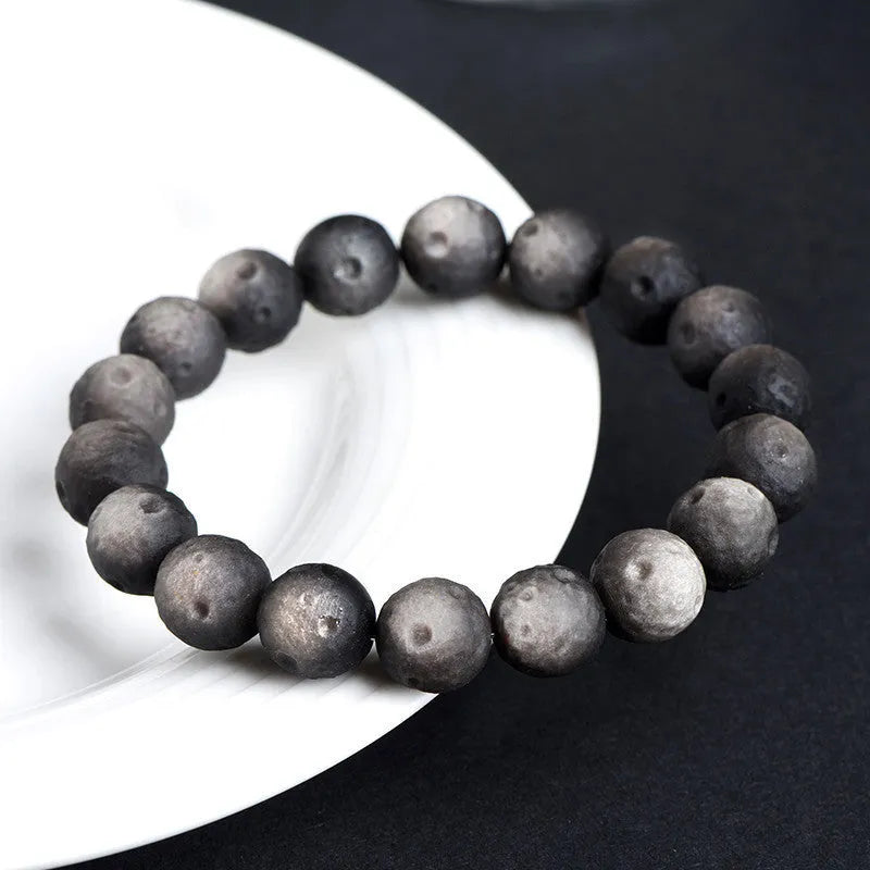 Natural obsidian crater ball bracelet with grinding texture in silver or gold meteorite finish