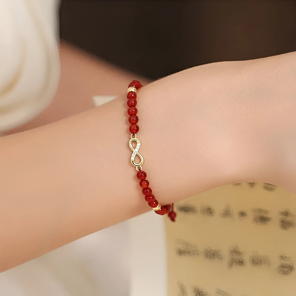 Natural red agate hand-woven bracelet showing diamond-shaped beads in ethnic woven pattern