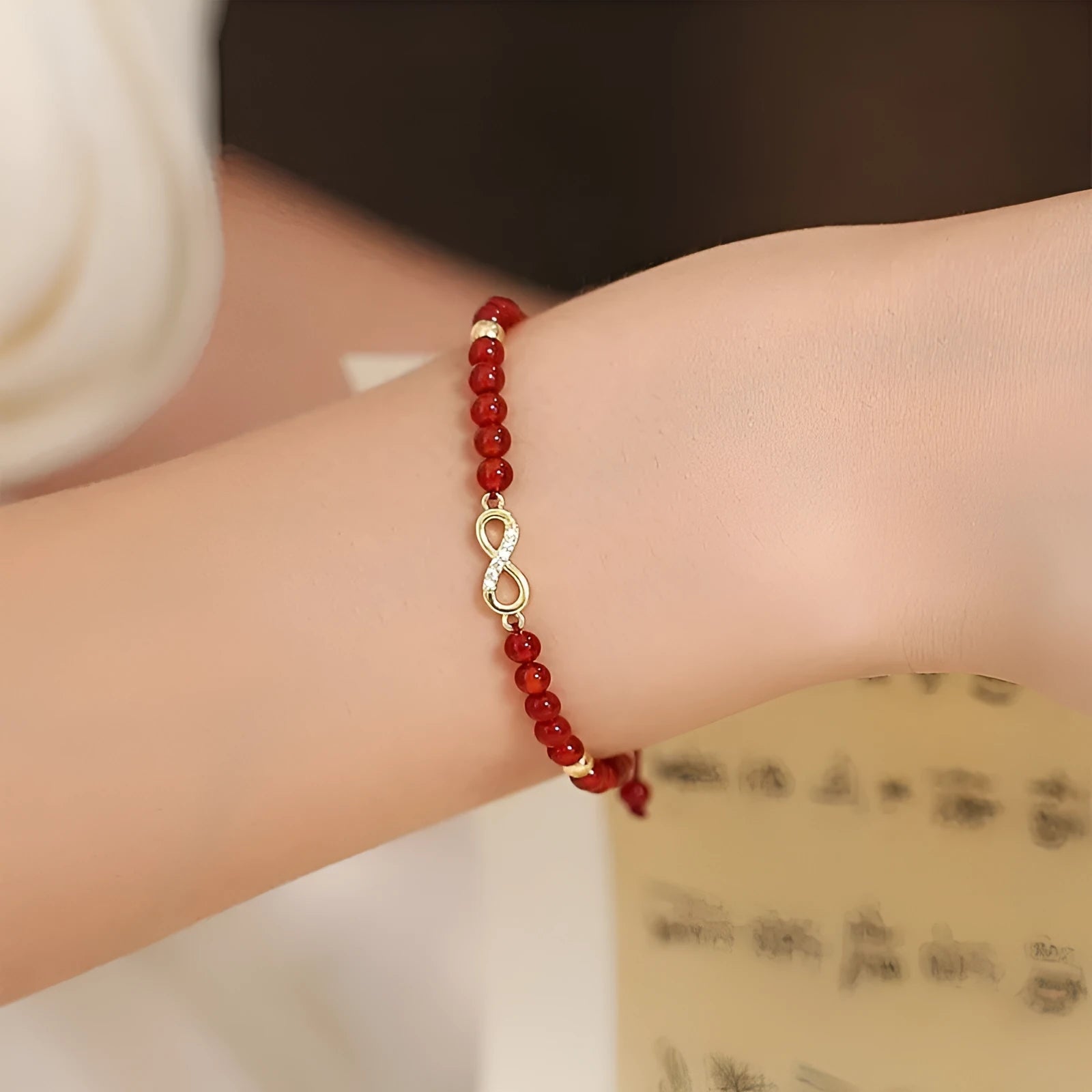 Natural red agate hand-woven bracelet showing diamond-shaped beads in ethnic woven pattern