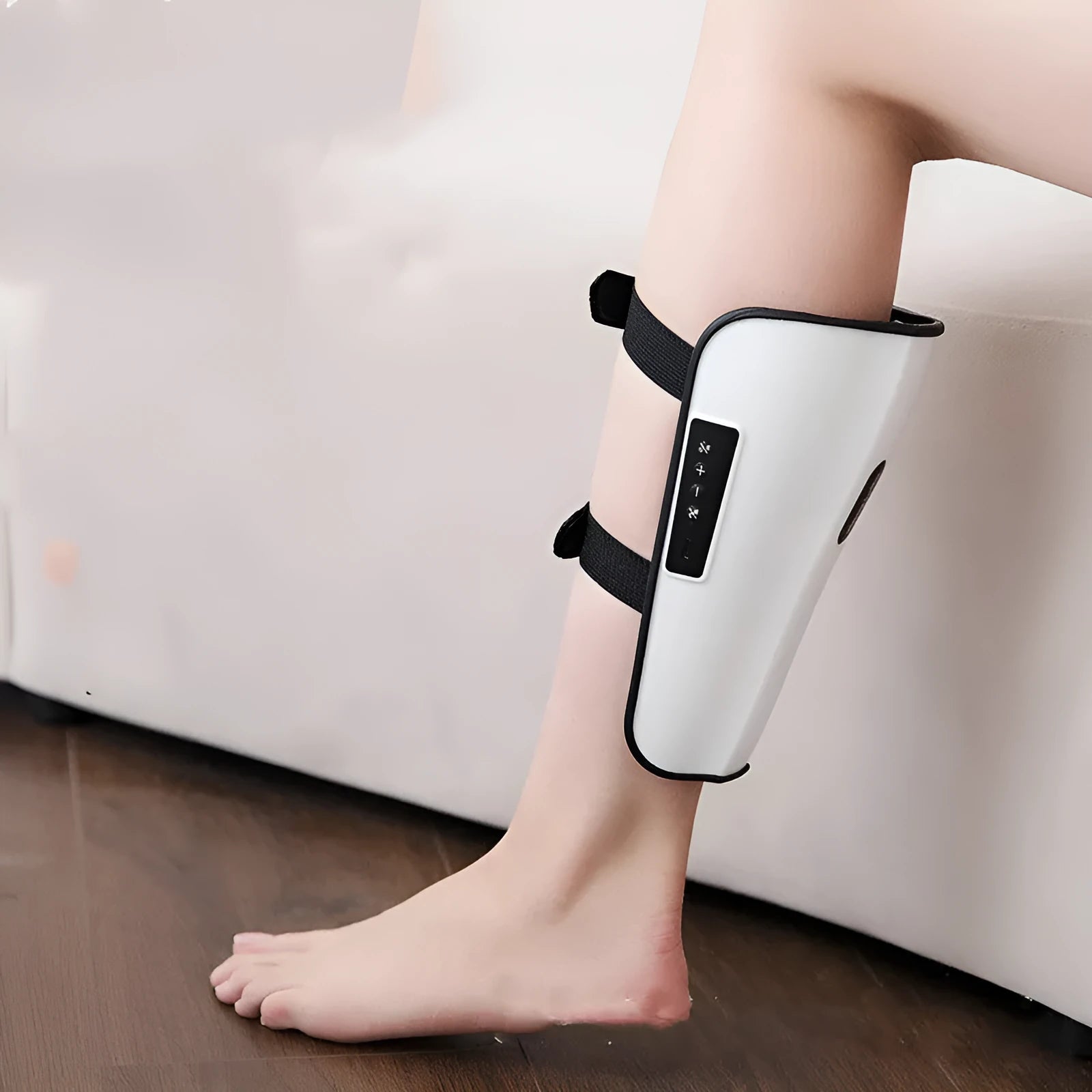White plastic calf massager with mechanical controls and USB Type-C connection port