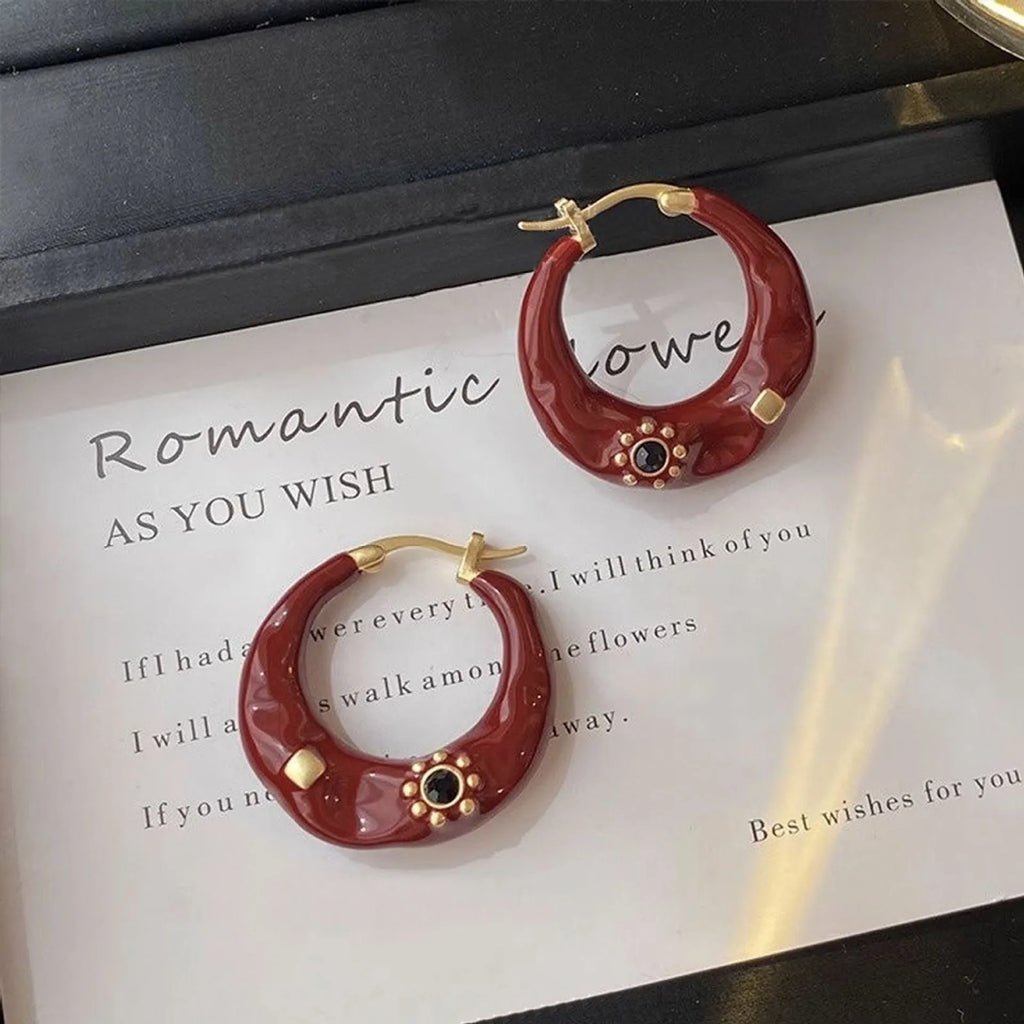Retro Hong Kong style ear studs with rhinestone inlay and dripping oil textured finish in black and red colours