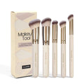 Five angled apricot-coloured makeup brushes for powder blush and foundation application