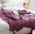Nordic style fringed acrylic knit blanket in plain weave showing beige colour option