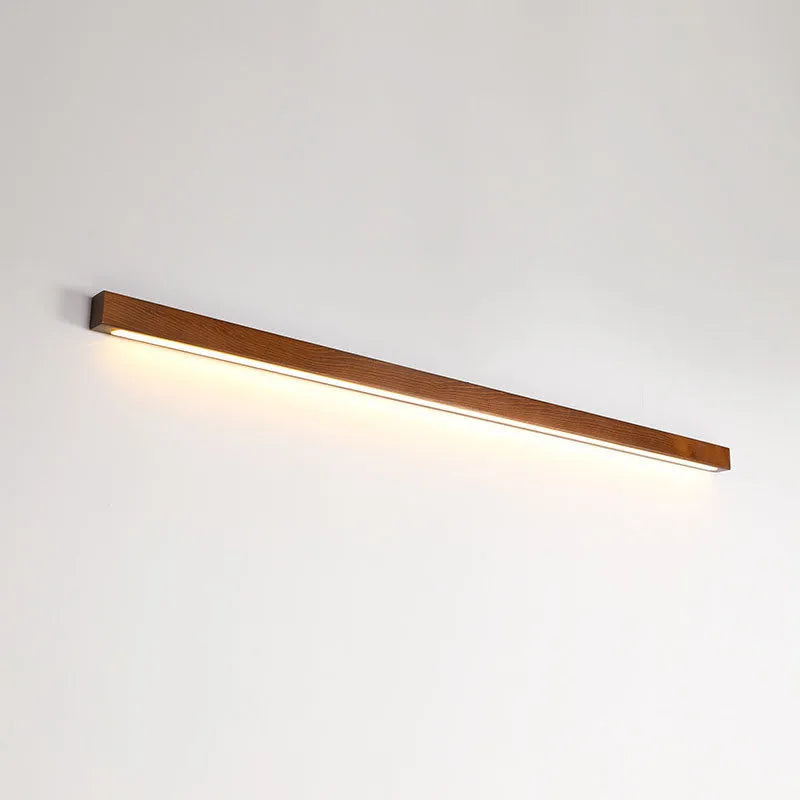 Walnut-coloured wood and acrylic linear LED strip wall lamp in a modern minimalist style.