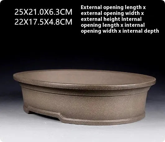 Handmade purple sand ceramic antique oval bonsai flower pot measuring 25x21x6.3cm