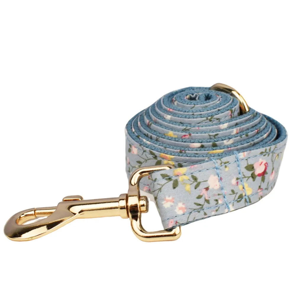Blue floral polyester cotton dog collar set with leash, bow, vest and poop bag accessories