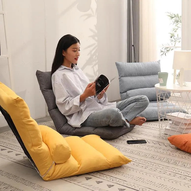 Adjustable floor lazy sofa in beige with 6-level backrest and high-elastic-sponge filling, shown in living room