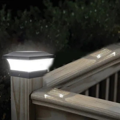Compact solar garden LED landscape light with ground spike in garden setting