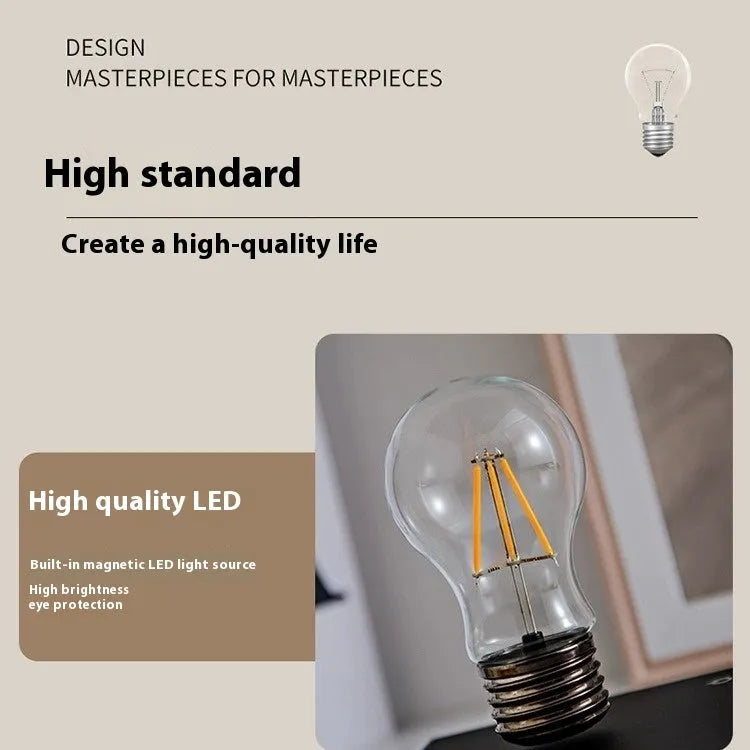 Suspension bulb creative night lamp with iron art construction on black wood grain desktop base