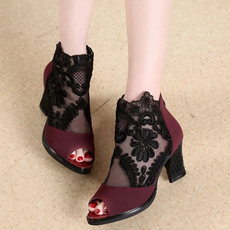 Black lace gladiator sandals with square high heel, peep toe and front zip closure