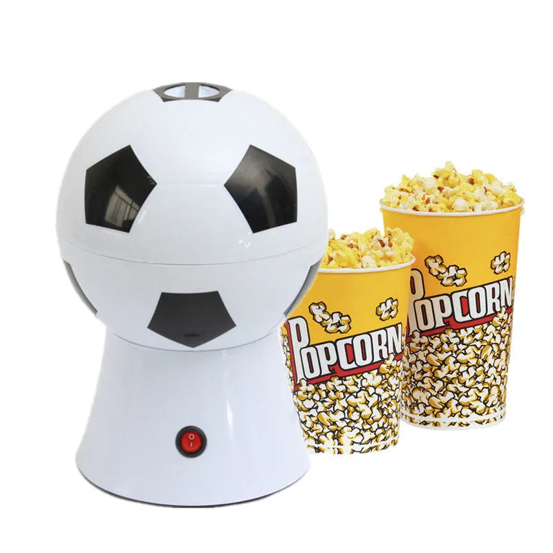 Black football-shaped electric popcorn machine with round insert and popcorn collector bowl